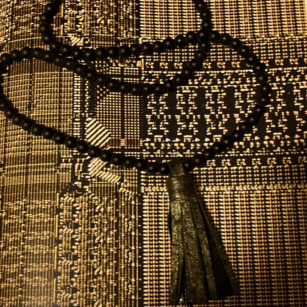Pretty, black pearls with tassel.